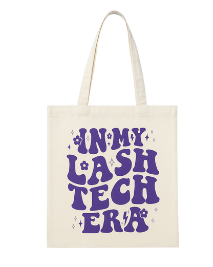 Tote bag with 'IN MY LASH TECH ERA' text in purple on a white background